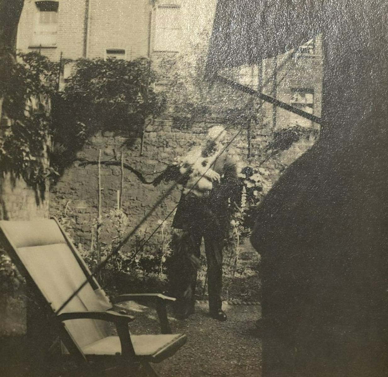 W. L. Janes and George the Cat in the Eliot's garden at 57 Chester Terrace, 1928.